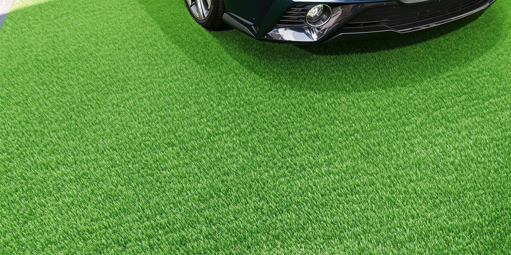 A car parked on vibrant green artificial grass, showcasing a well-maintained lawn ideal for lawn care services.